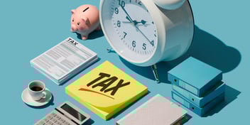 a desk with a clock, piggy bank, sticky notes that say the word TAX and a calculator