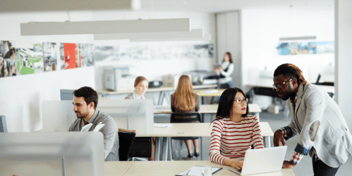 colleagues working in a bright, open work space